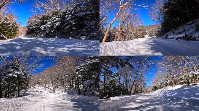 在冬季山区积雪覆盖的道路上行驶