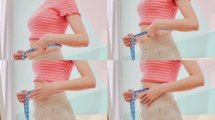 女人测量肥胖的腹部