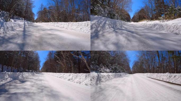 冬季在多雪山区的森林道路上行驶