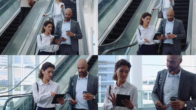 使用平板电脑的女商人与商人同事讨论工作，在办公室大厅4k的自动扶梯上展示企业高管的想法