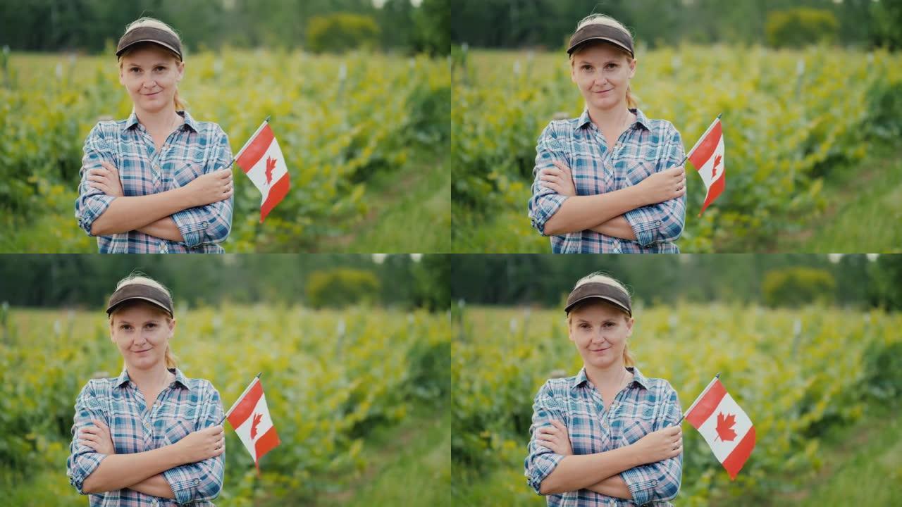 带着加拿大国旗的女农民看着相机。加拿大农民的肖像