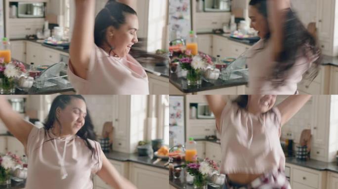 快乐超重的少女在厨房跳舞开心庆祝周末在家表演有趣的舞蹈动作享受周末庆祝