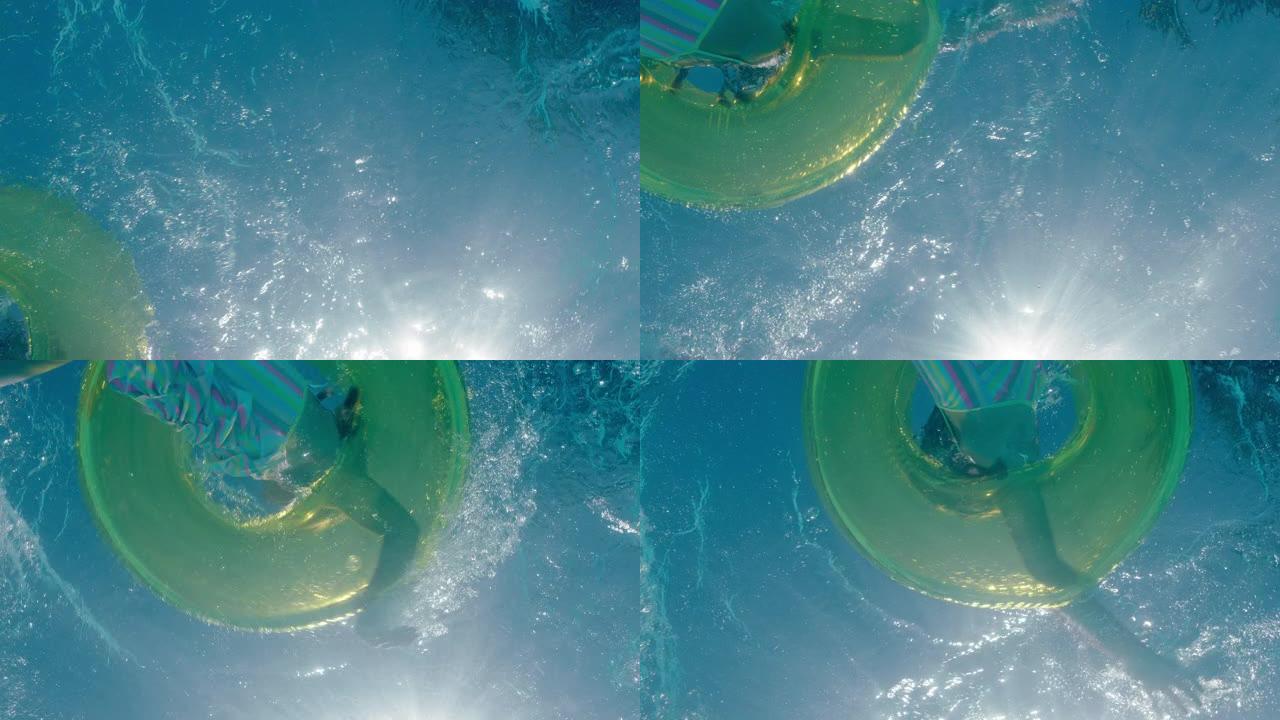 水下景观小女孩在游泳池里游泳，带彩色游泳圈充气玩具孩子嬉戏地在水上嬉戏玩耍，漂浮着享受夏日pov 4