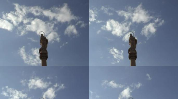 天使雕像上的云。时间。(宽镜头)