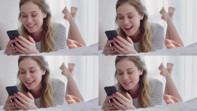 美丽的女人用智能手机视频聊天，和朋友聊天，享受躺在床上放松的谈话