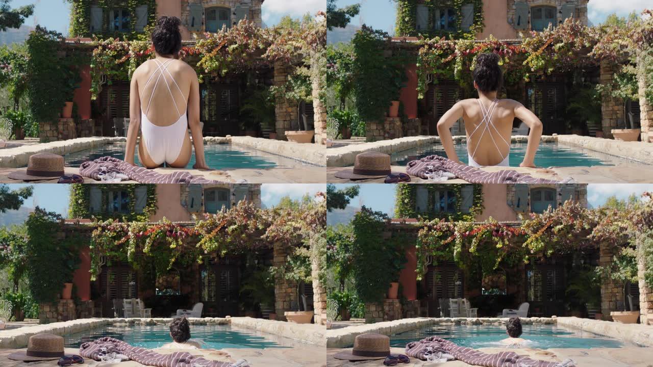 性感的女人在美丽的假日别墅游泳池游泳，享受晒日光浴华丽的女游客暑假穿着比基尼4k镜头