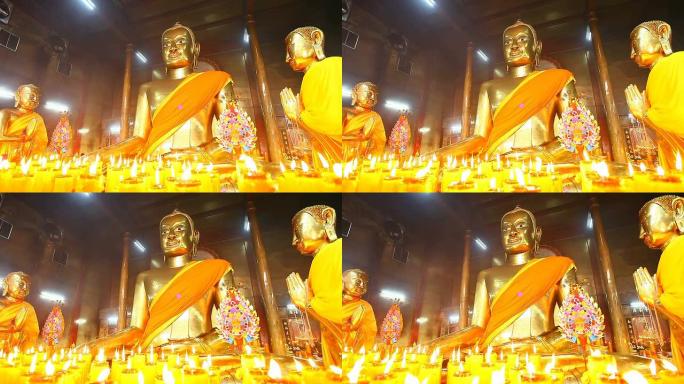 多莉: 寺庙里有蜡烛的佛像，高清1080P