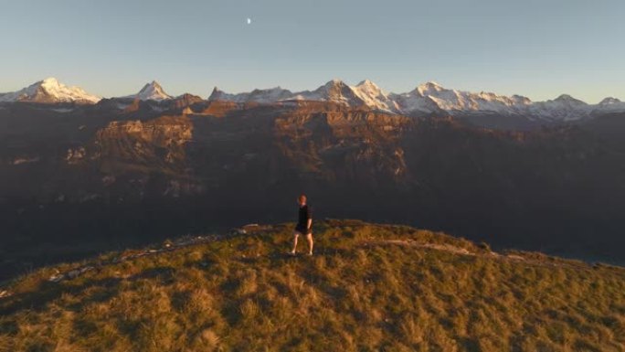 在瑞士阿尔卑斯山因特拉肯的背景下徒步旅行的人的鸟瞰图
