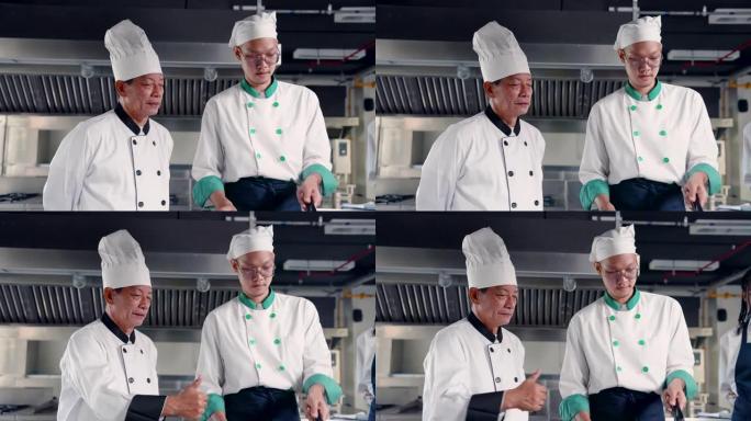 4K，主厨在这个厨房里站着讲解烹饪学生听课，同时允许助理厨师炒菜让学生在实践中看到，然后让学生采取行