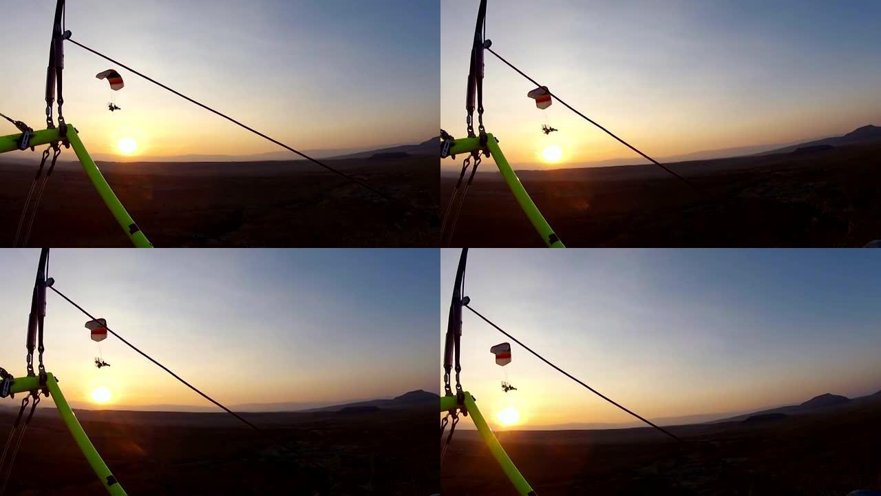 飞行员动力降落伞日落飞行沙漠