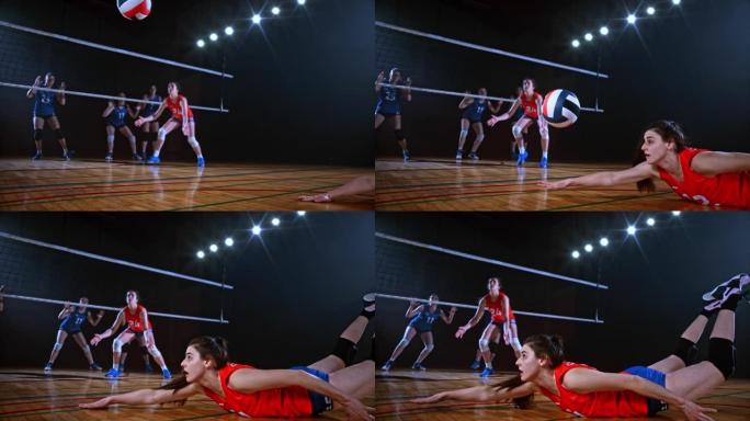 身穿红色球衣的SLO MO LD女子排球运动员击球后倒地
