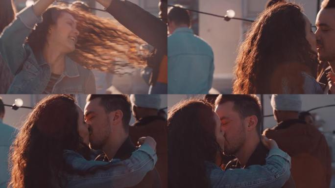 快乐的年轻夫妇亲吻享受屋顶派对跳舞，在日落时的不同社交聚会上分享浪漫关系