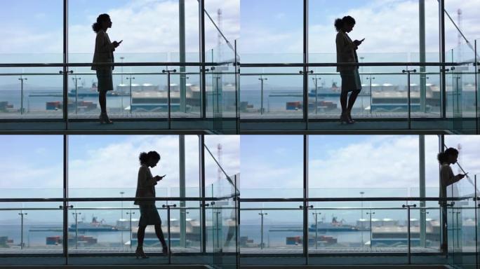 商务女性使用智能手机短信浏览电子邮件公司高管在大厅等待港口4k镜头