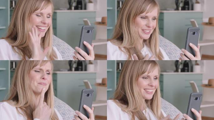 年轻的聋哑妇女手持智能手机进行视频聊天，使用手语挥舞着享受手机上的连接聊天