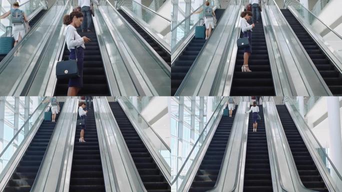 混合种族商务女性使用智能手机上网浏览女性通勤者在自动扶梯上出差在办公室步行地铁大厅4k