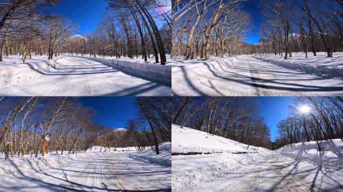 在冬季山区积雪覆盖的道路上行驶