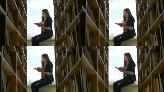 女学生在图书馆的窗台上看书。特写