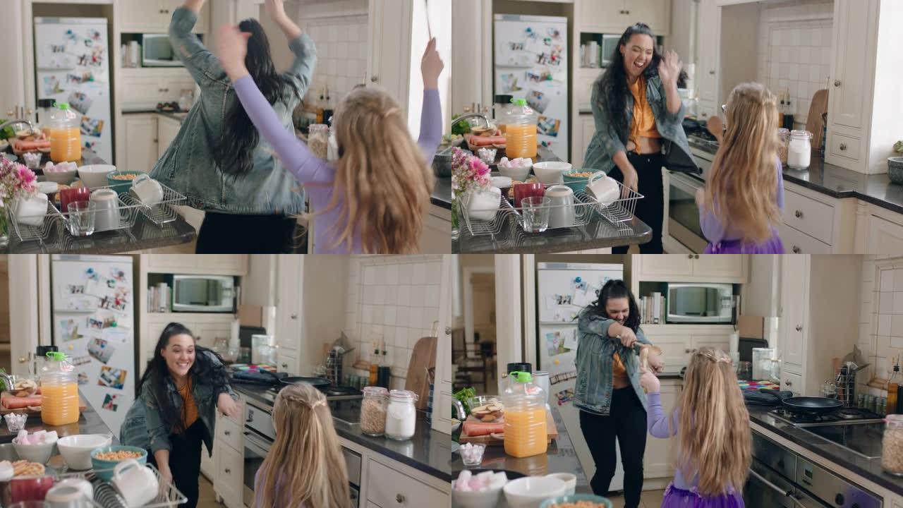 快乐的姐妹们在厨房一起跳舞，在家享受周末庆祝舞蹈庆祝活动