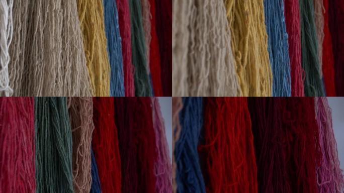 编织传统手工丝绸地毯的女人。