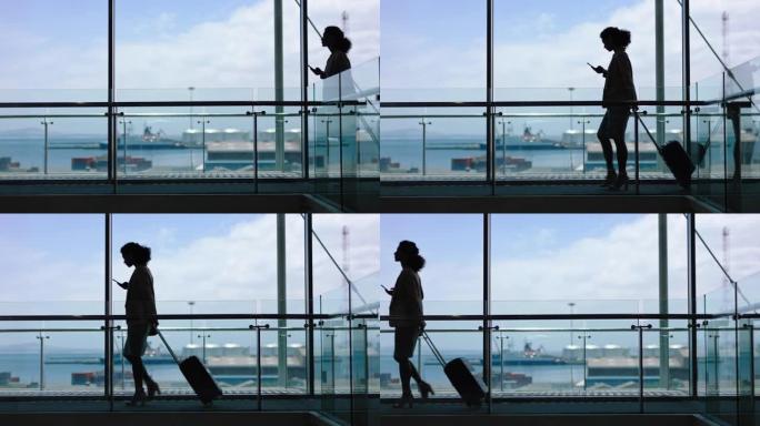 商务女性带着拉杆包行走，使用智能手机在机场大堂进行国际商务旅行，可以看到港口4k镜头