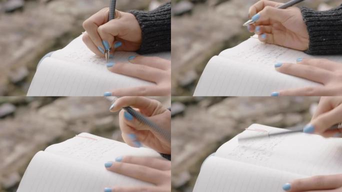 亲密的手女人在日记日记中写作少女在海边海滩上表达孤独的想法