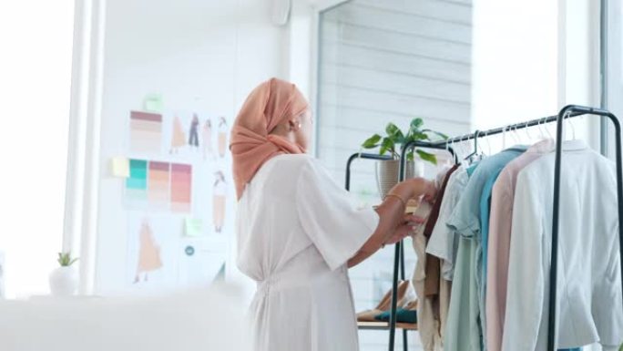 穆斯林妇女，时装设计师和商店中的服装生产线以确保质量保证或产品设计。伊斯兰女性小企业主在头巾检查铁路