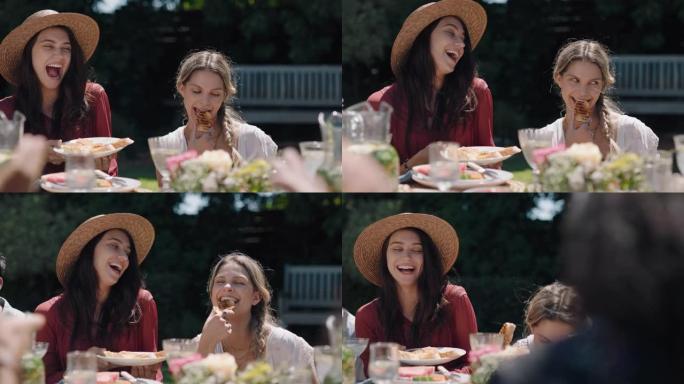 快乐的朋友享受花园派对野餐，美丽的女人做鬼脸一起笑，在阳光明媚的周末在社交聚会上放松