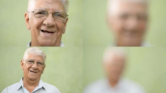 快乐的老人，戴眼镜的老人对着镜头微笑