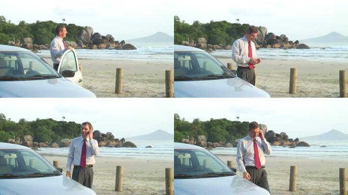 商人在海滩上的汽车旁用手机聊天