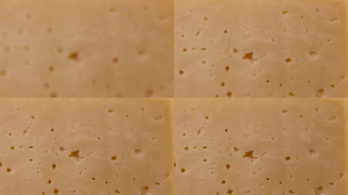 一块带有孔的硬奶酪特写