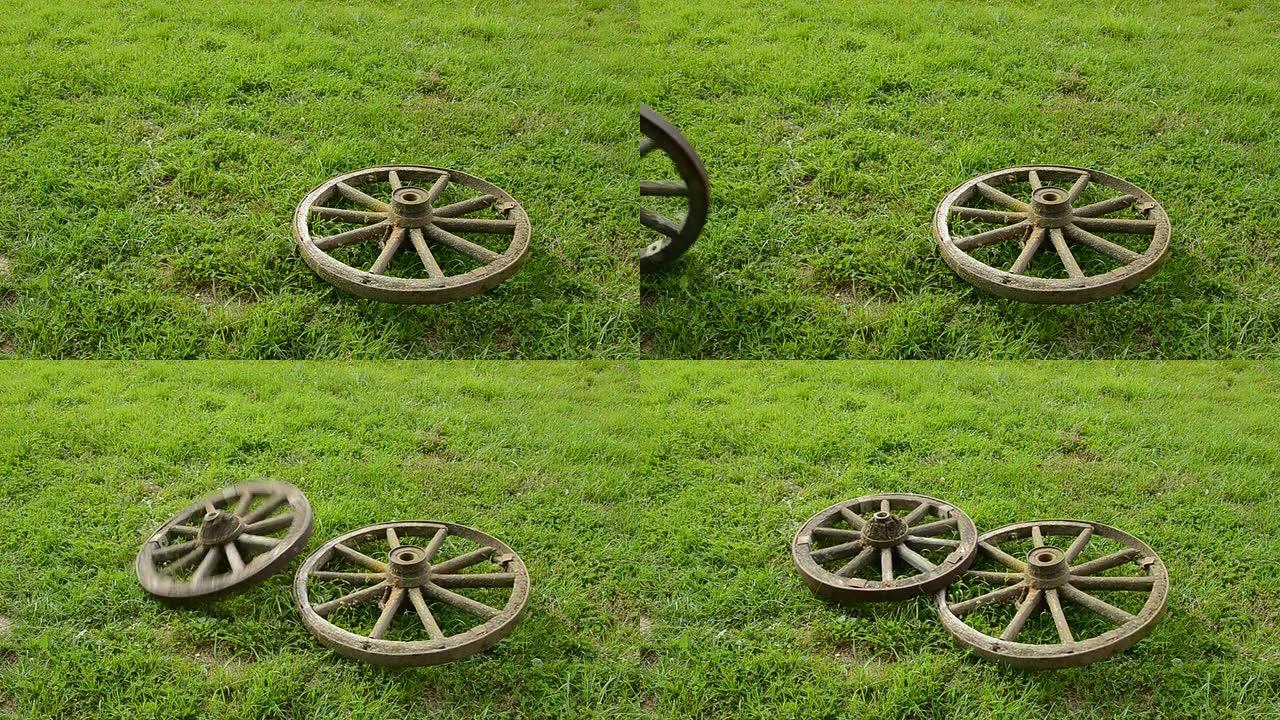 草地上的两个旧马车轮子