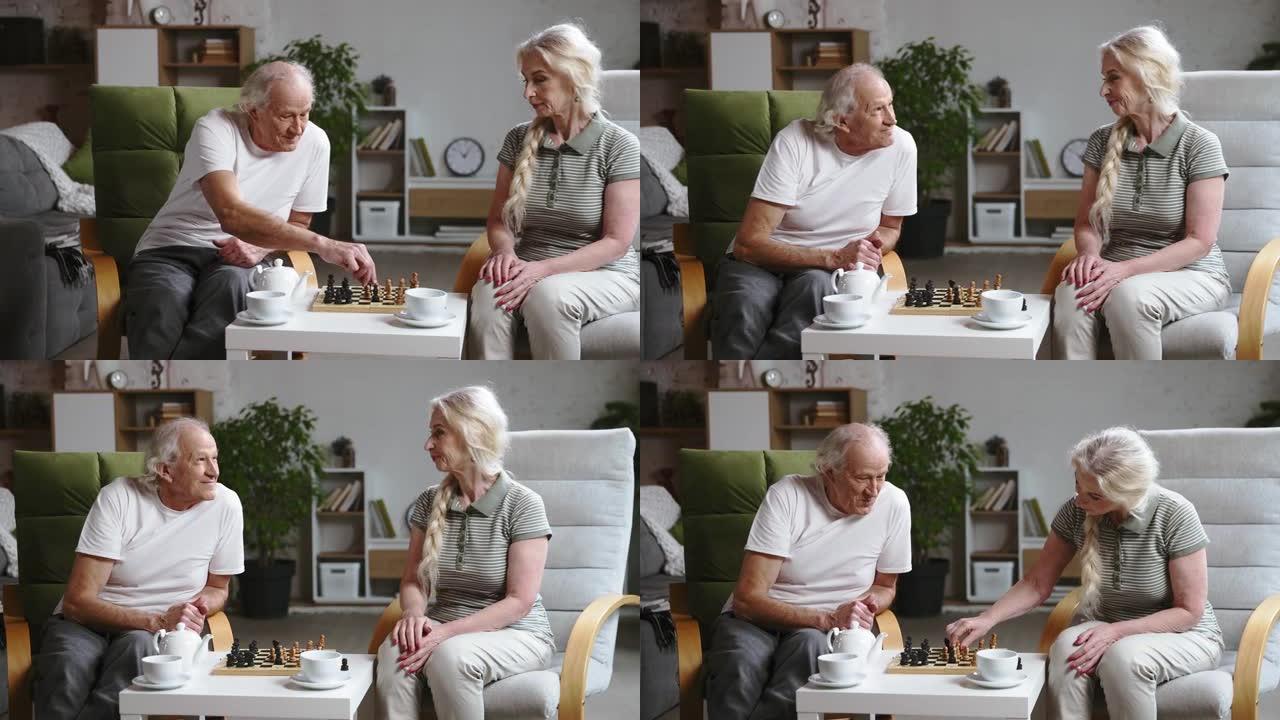 幸福的老年夫妇，退休的男女在家里度过时光，一起下棋，喝茶。闲暇时间和爱好