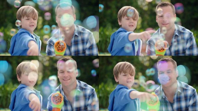 父亲和儿子一起在阳光明媚的公园吹肥皂泡快乐的小男孩玩得开心爸爸和孩子玩得很开心，享受夏天4k