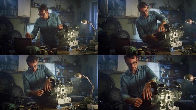 一个男人在他的家庭车间里使用笔记本电脑并正在修理水泵发动机的肖像。快乐的专业男工程师看着相机，摆姿势