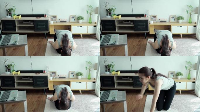 年轻女子在家练习瑜伽垫