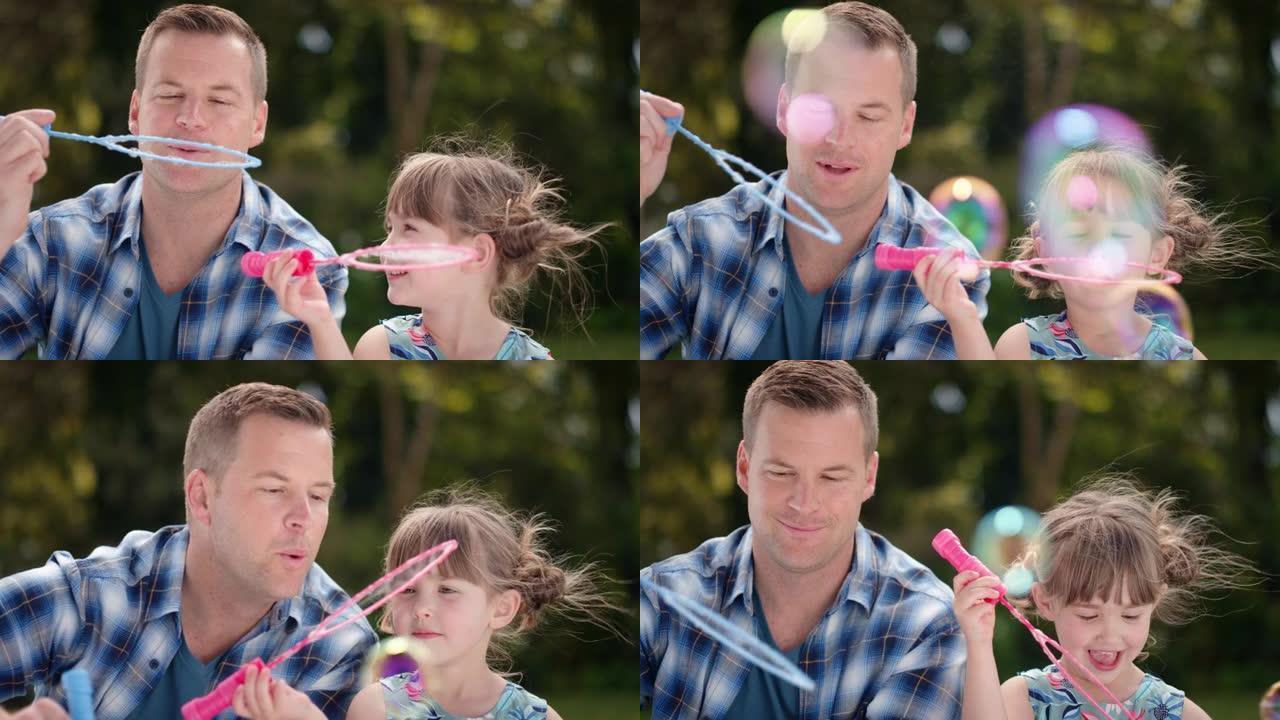 父亲和女儿一起在阳光明媚的公园吹肥皂泡快乐的小女孩玩得开心爸爸和孩子玩耍享受夏天4k