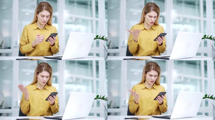 紧张的金发成熟女商人在工作场所因智能手机服务不佳而遇到问题