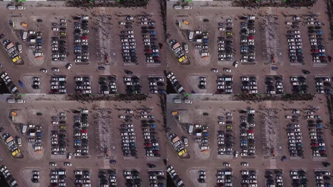 汽车在停车场移动和站立，航拍画面。购物中心停车无人机视图上的汽车交通。