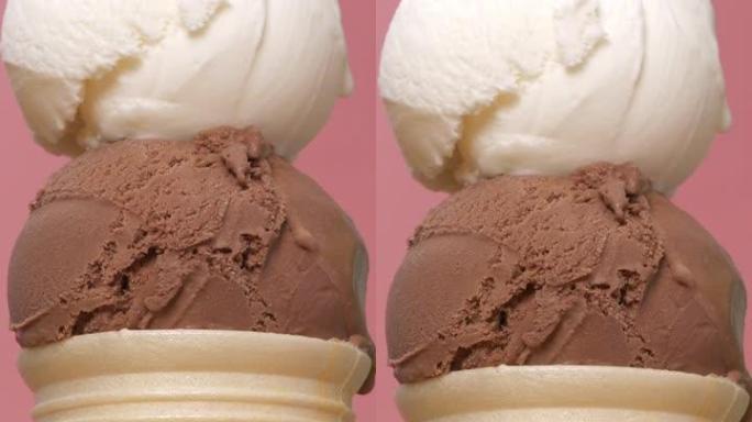 两种口味的冰淇淋堆叠在一个圆锥体上。