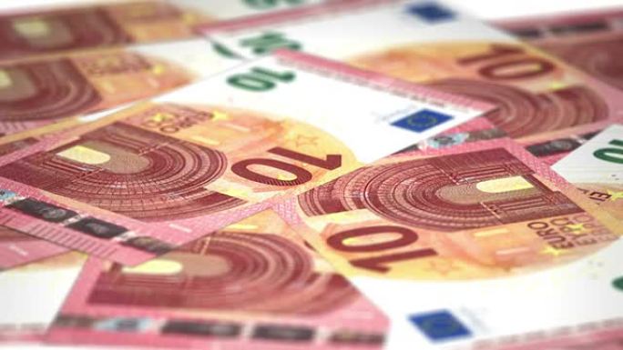 金钱新的10欧元钞票在具有景深的盘子上循环