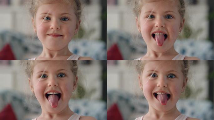 肖像可爱的小女孩嬉戏做鬼脸看着相机玩得开心淘气的孩子享受快乐孩子4k的有趣表情