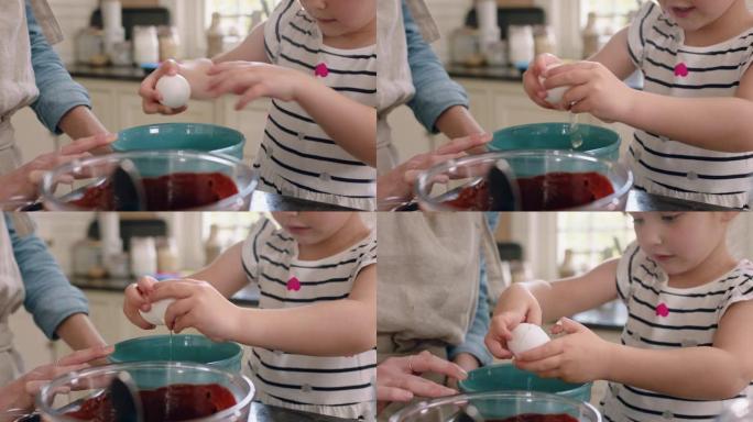 美丽的小女孩帮助妈妈在厨房里烘烤，把鸡蛋打碎成碗里搅拌配料烘烤巧克力蛋糕在家准备食谱