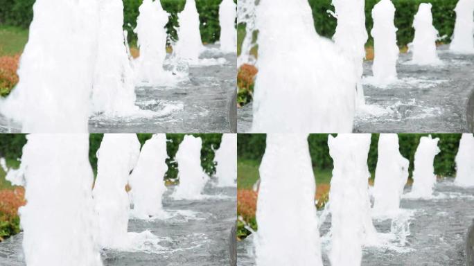 花园里一排喷泉，有水声