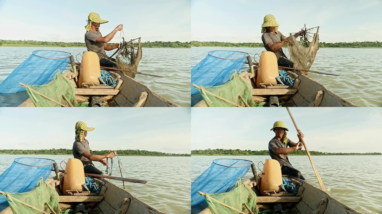 虾渔夫诱饵网的关闭，将其放到更深处的河中，划船以获取新的渔获物