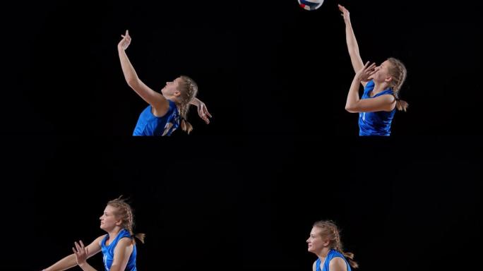 身穿蓝装的SLO MO女子排球运动员跳球击球