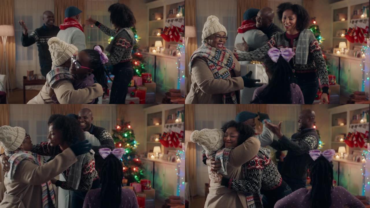 非裔美国祖父母圣诞拥抱家庭赠送礼物，享受冬季晚上在家的节日庆祝活动4k镜头