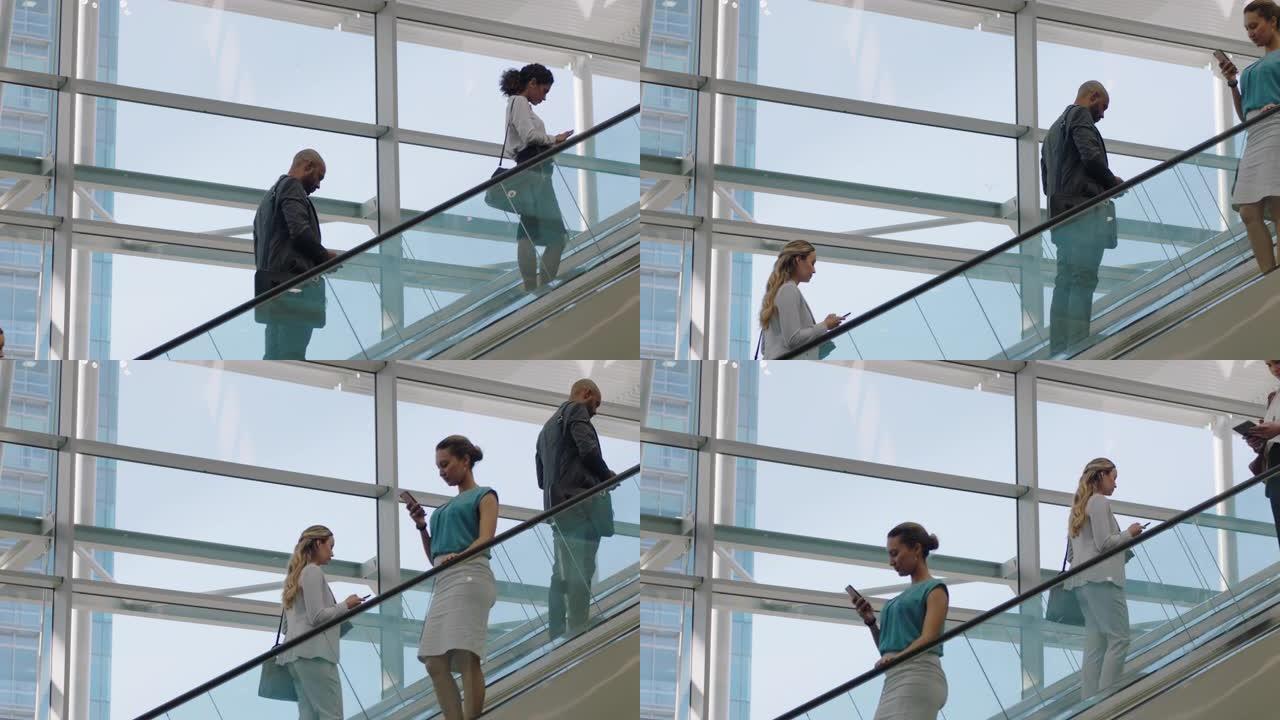 繁忙的公司办公室大厅中的自动扶梯上的商人工作9到5个高峰4k镜头