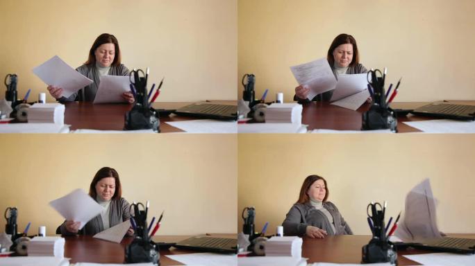 办公室里的女雇员将文件分发得很累