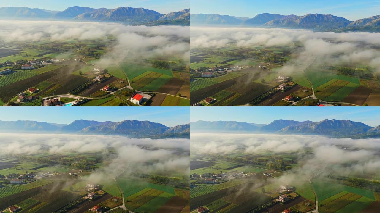 在Atena Lucana附近的山脉和晴朗的天空中，雾笼罩着错落有致的景观。
