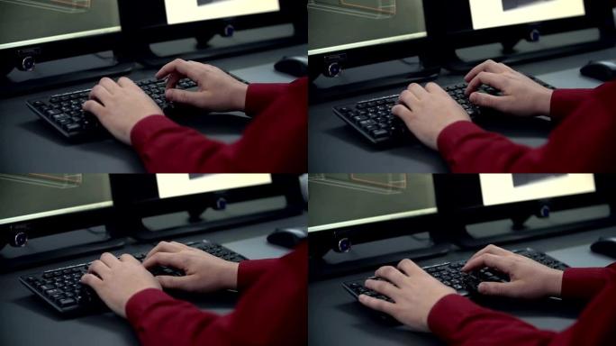 男性手在电脑键盘上打字